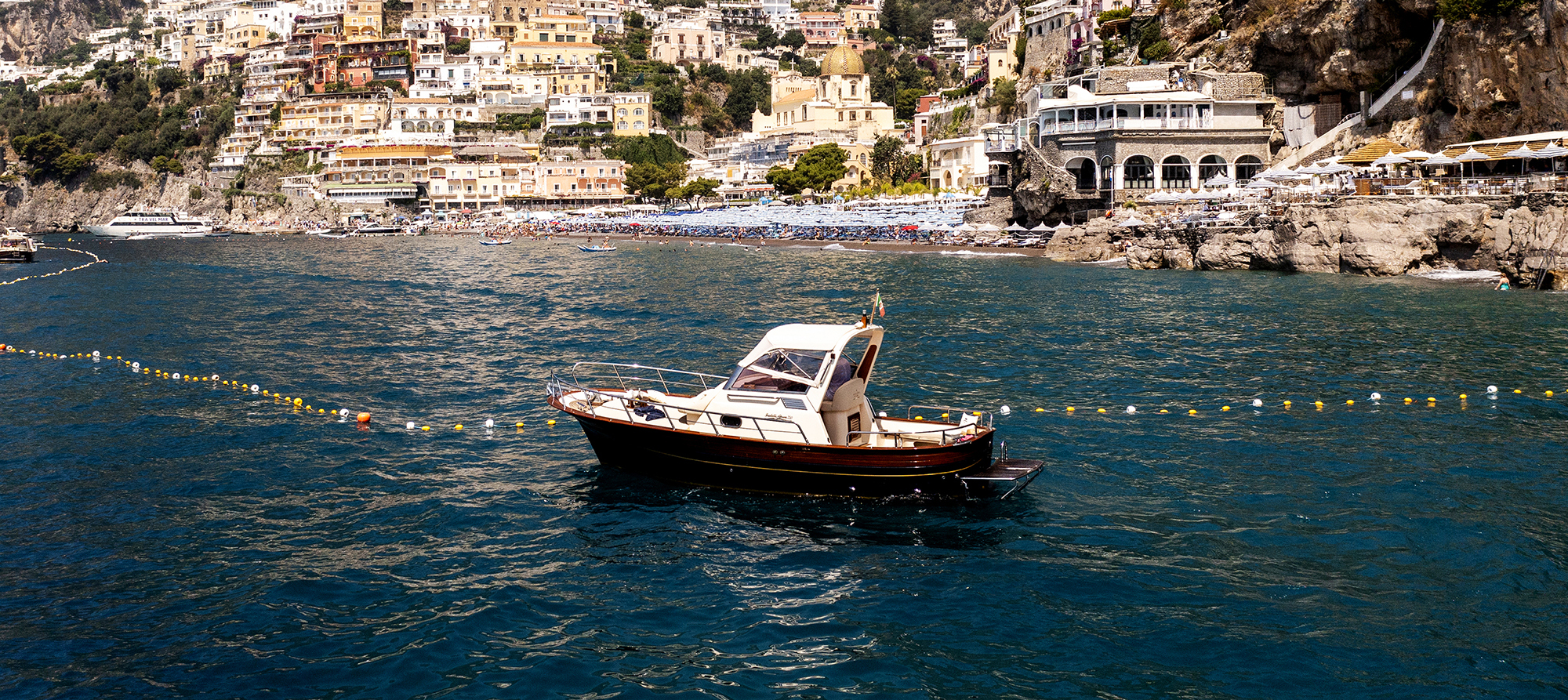 Captain Angelo aboard the Dama Charter boat on the Amalfi Coast